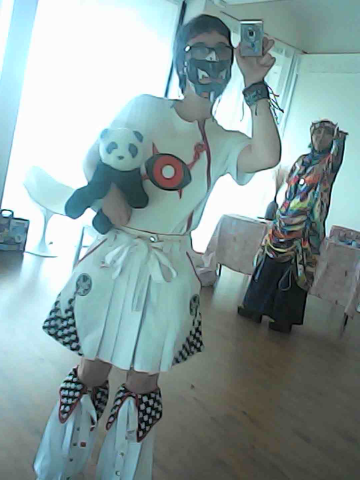 My outfit, mirror camera selfie with my black jaw mask on. I'm holding my stuffed panda Jumbo.